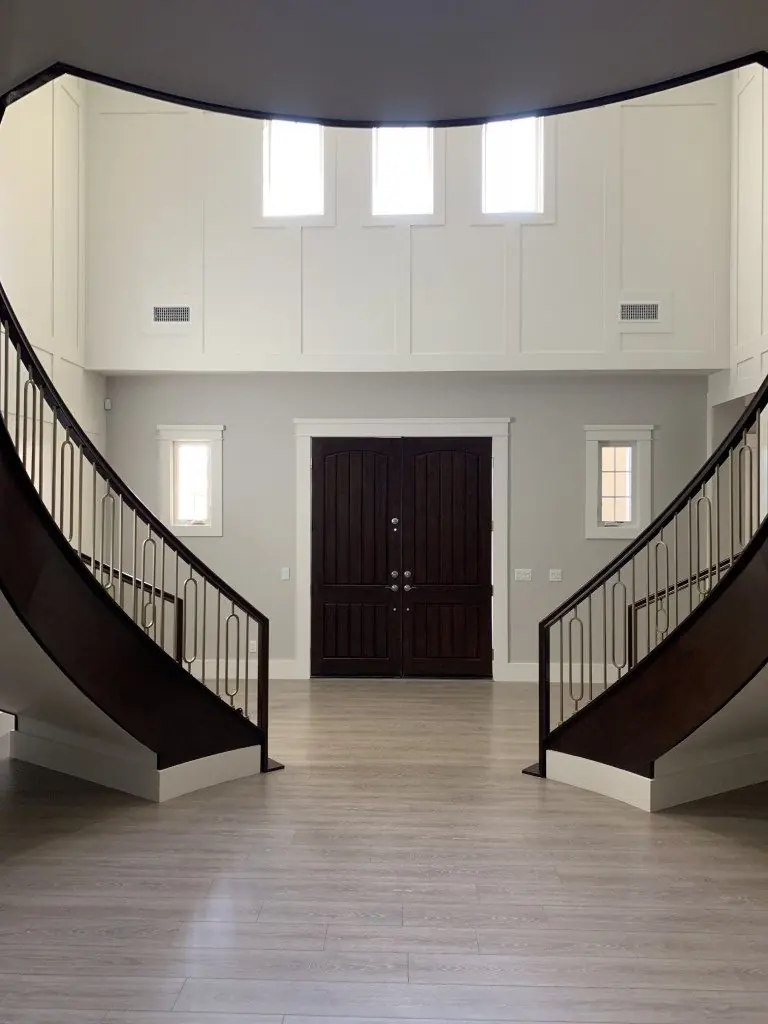 Double staircase entry with freshly painted walls