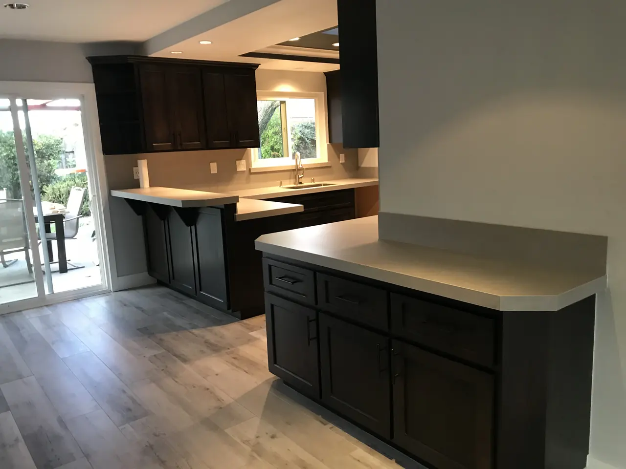 Kitchen with espresso cabinets refinished by Veeto Painting
